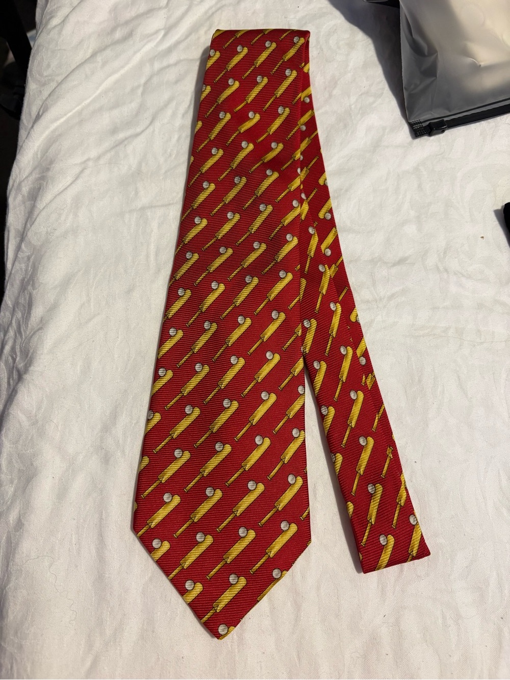 CHANEL Red Tie with Yellow Golf Tee Motif